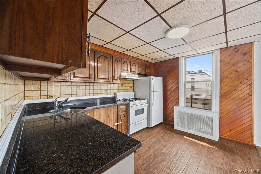 Welcome to this solid brick two-family home in the popular - photo 5