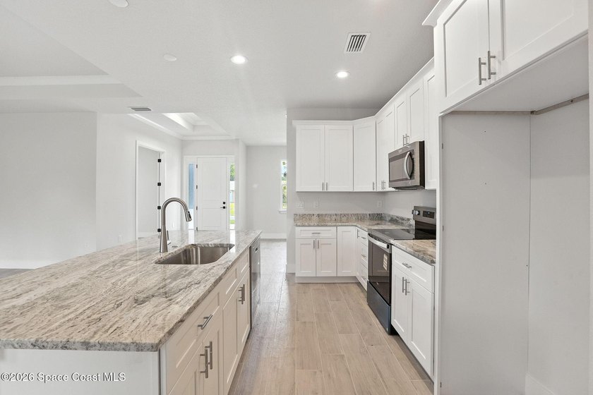 10K CLOSING COST CREDIT!! Welcome to your dream home! This - photo 6