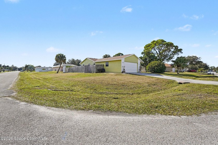 Nestled in the desirable NW Palm Bay community on a fully fenced - photo 3