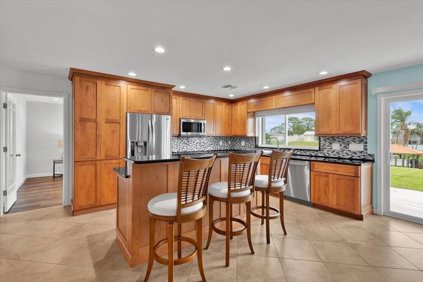 Beautifully maintained 3 BR, 2.5 BA waterfront home with 94' of - photo 13
