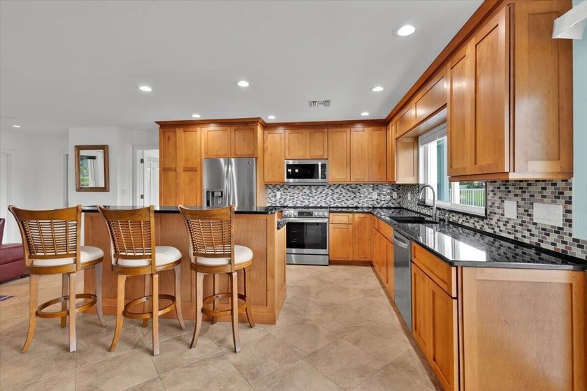 Beautifully maintained 3 BR, 2.5 BA waterfront home with 94' of - photo 21