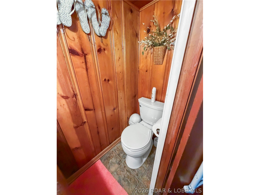 Lake of the Ozarks waterfront property featuring natural stone - photo 26