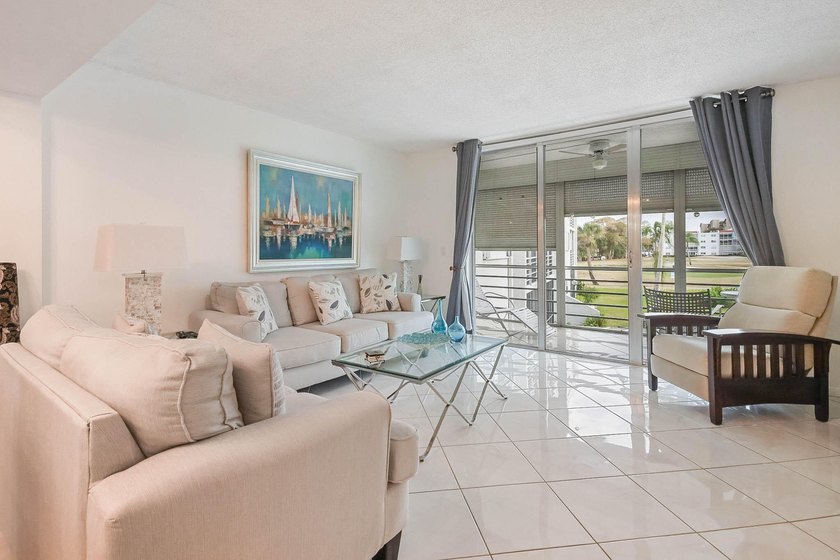 WELCOME TO THIS NATURALLY BRIGHT CONDO WITH SOUTH FACING BALCONY - photo 3