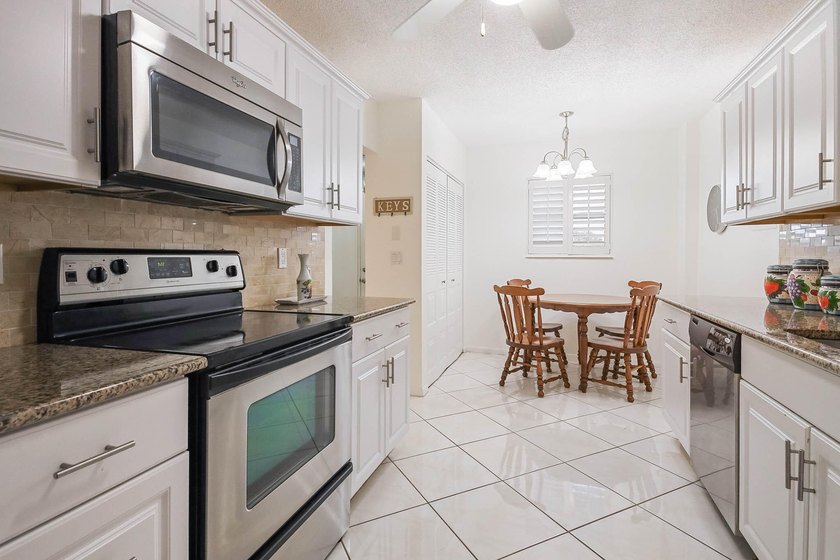 WELCOME TO THIS NATURALLY BRIGHT CONDO WITH SOUTH FACING BALCONY - photo 7