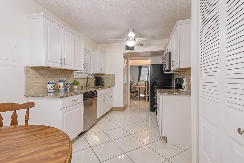 WELCOME TO THIS NATURALLY BRIGHT CONDO WITH SOUTH FACING BALCONY - photo 8