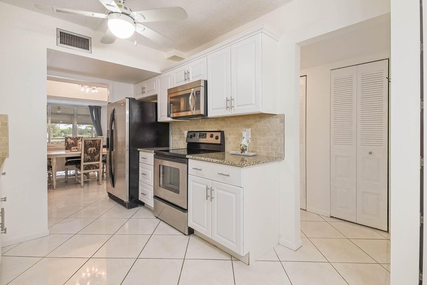 WELCOME TO THIS NATURALLY BRIGHT CONDO WITH SOUTH FACING BALCONY - photo 10