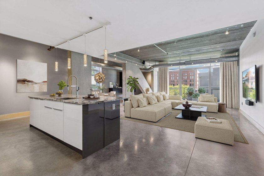 Unit 202 features a rare opportunity to own a spacious - photo 2