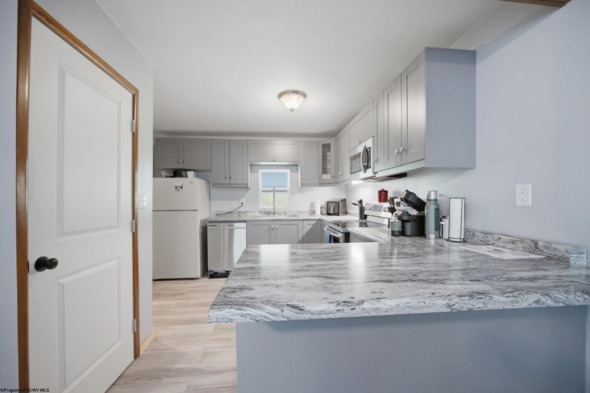 This charming 3-bedroom, 1-bath home is ideally located just - photo 7