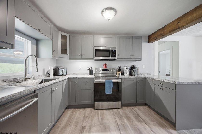 This charming 3-bedroom, 1-bath home is ideally located just - photo 8