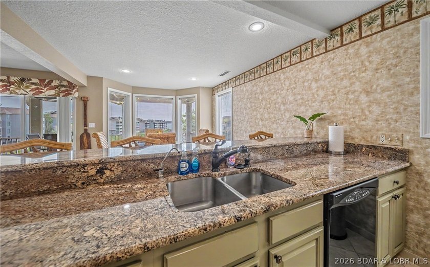 Enjoy stunning lake views from your screened-in deck overlooking - photo 11