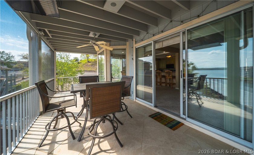 Enjoy stunning lake views from your screened-in deck overlooking - photo 15