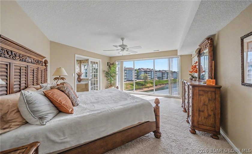 Enjoy stunning lake views from your screened-in deck overlooking - photo 16