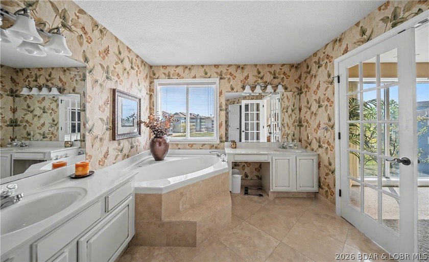 Enjoy stunning lake views from your screened-in deck overlooking - photo 19