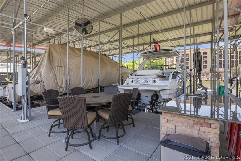 Lakefront Penthouse offers a rare 18 x 48 boat slip, partially - photo 35