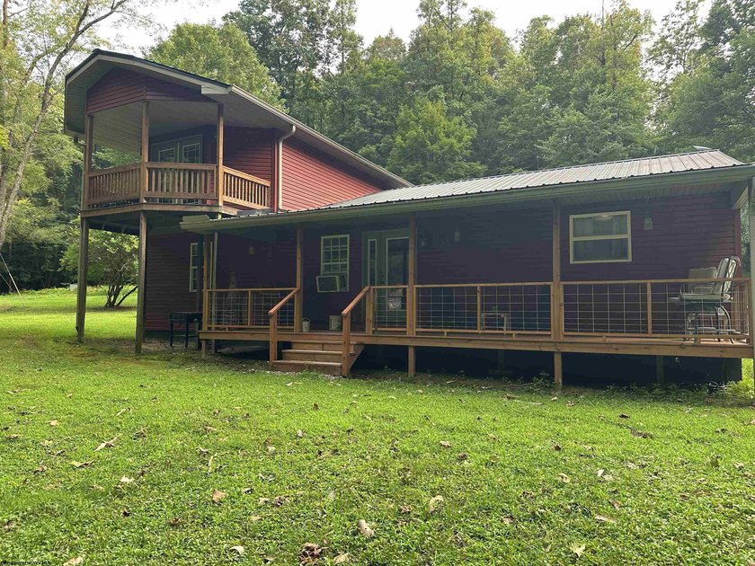 Riverfront retreat on 8 breathtaking acres! This beautiful home - photo 2