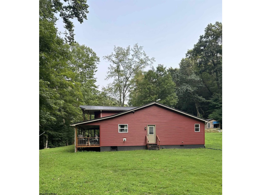 Riverfront retreat on 8 breathtaking acres! This beautiful home - photo 3