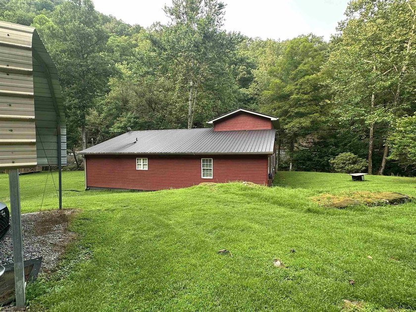 Riverfront retreat on 8 breathtaking acres! This beautiful home - photo 5
