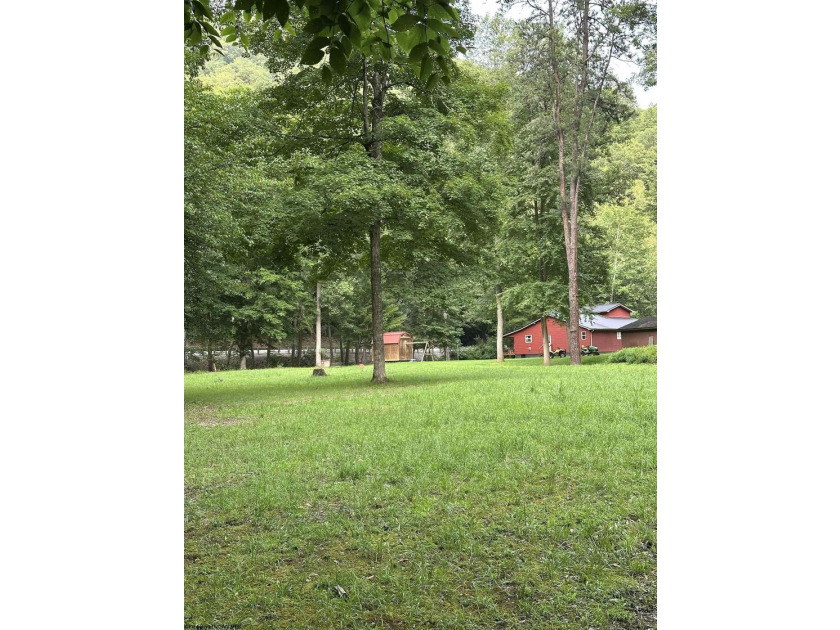Riverfront retreat on 8 breathtaking acres! This beautiful home - photo 6