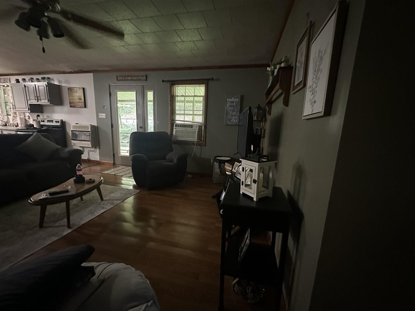 Riverfront retreat on 8 breathtaking acres! This beautiful home - photo 10