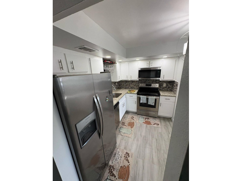 WOW!!! RARELY AVAILABLE REMODLED GROUND FLOOR CORNER UNIT - photo 16