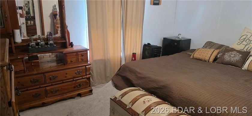 Large lakefront family home tucked back in a protective cove for - photo 31