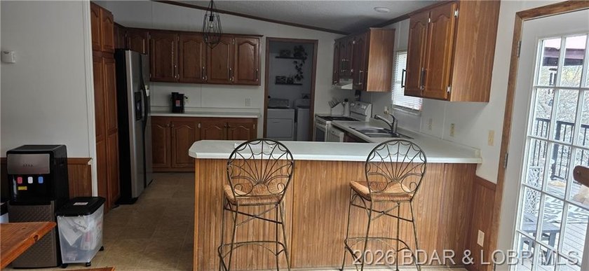 Large lakefront family home tucked back in a protective cove for - photo 37