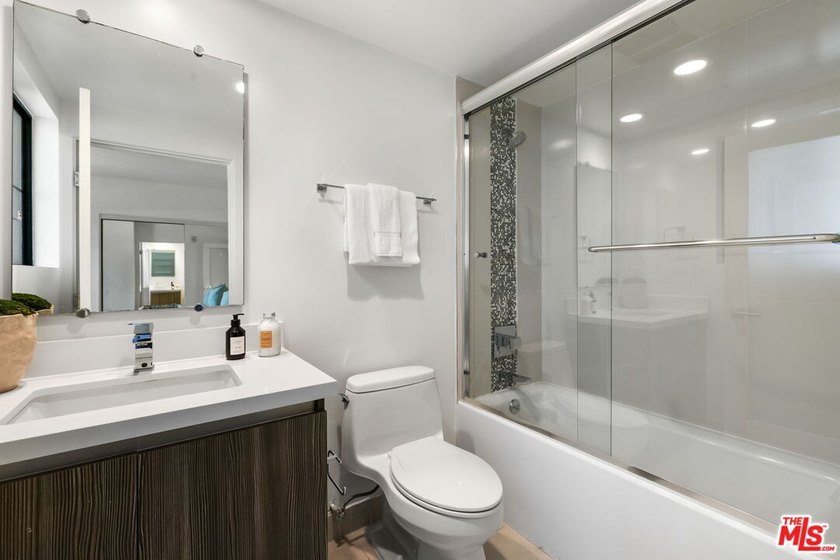Stunning newer contemporary condo right across the street from - photo 21