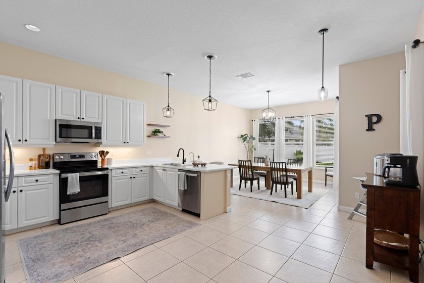 Welcome to this charming 3-bedroom, 2-bath home in the highly - photo 16