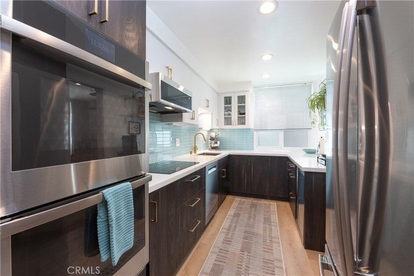 Welcome to this beautifully remodeled condominium in the highly - photo 21