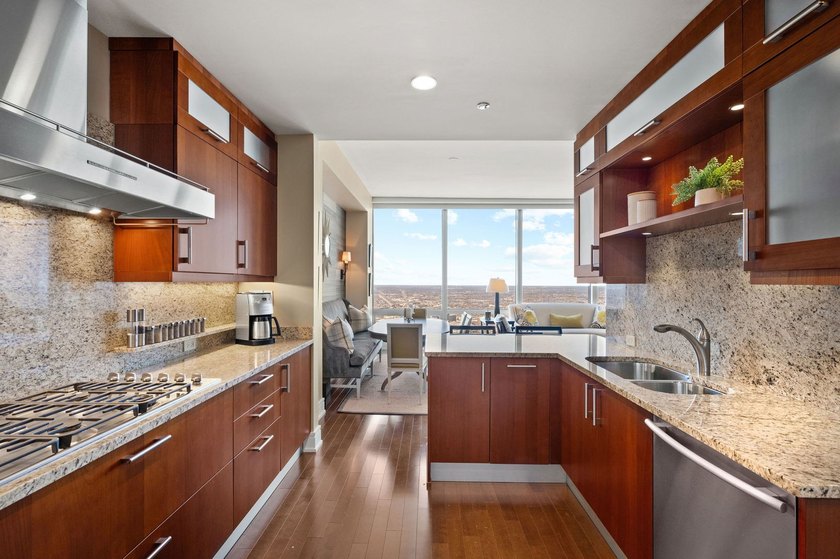 Perched 1,000 feet above the city skyline on the 79th floor is - photo 14