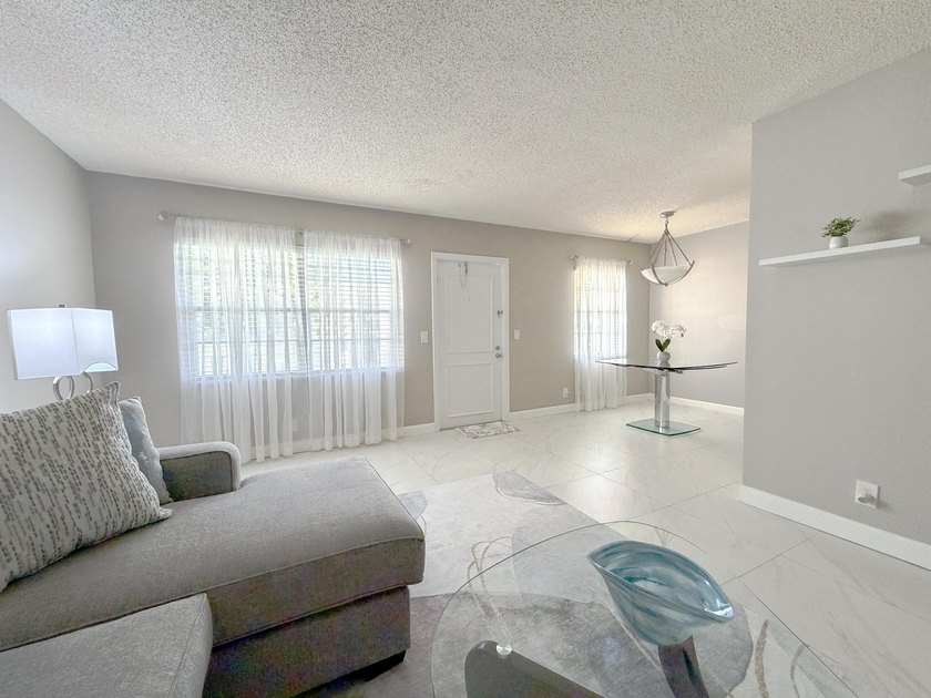Tastefully updated condo located in a desirable 55+ gated - photo 12