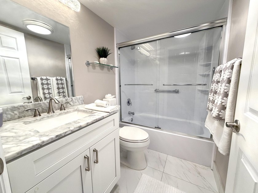 Tastefully updated condo located in a desirable 55+ gated - photo 14