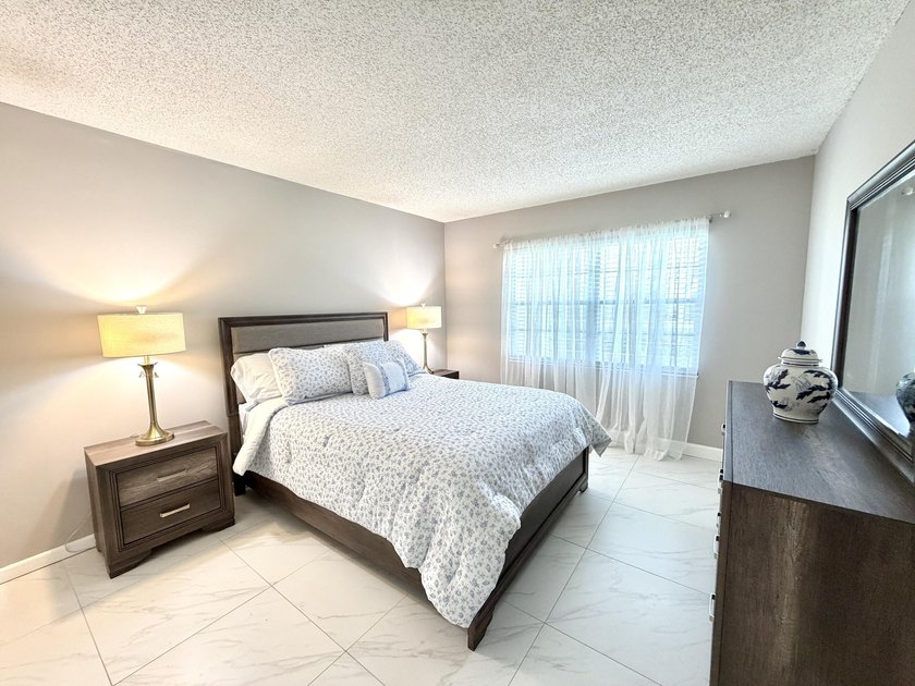 Tastefully updated condo located in a desirable 55+ gated - photo 15