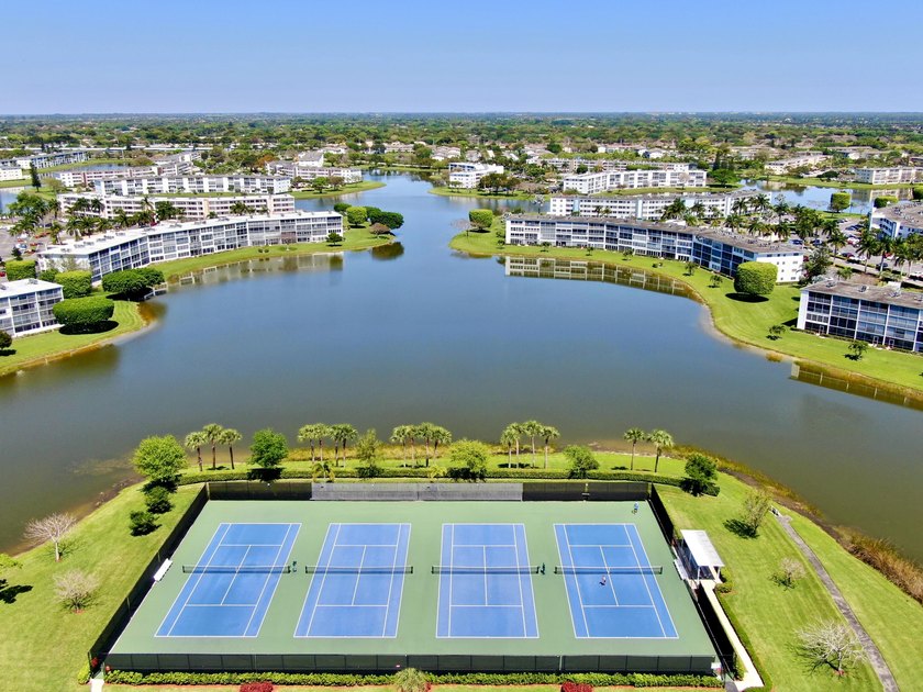 Tastefully updated condo located in a desirable 55+ gated - photo 32
