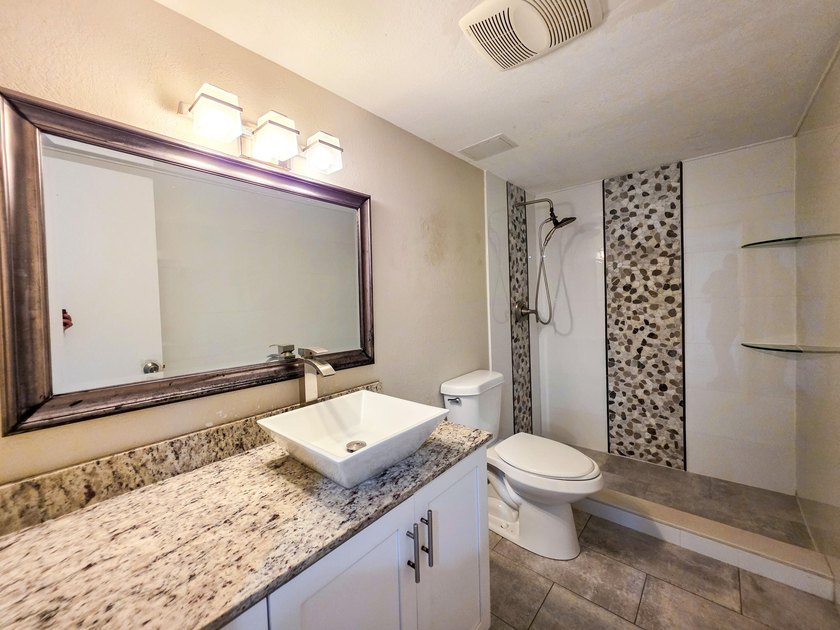 Welcome to this thoughtfully designed three-bedroom - photo 13