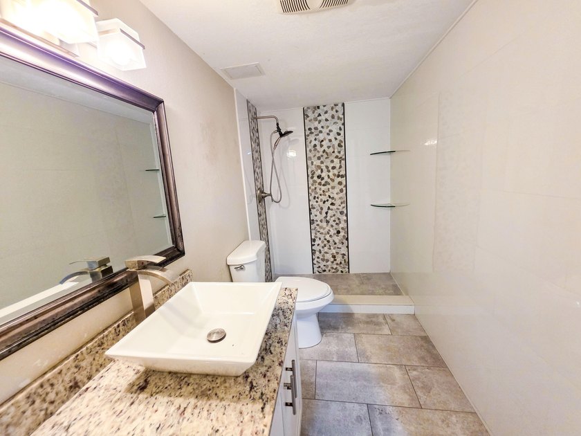 Welcome to this thoughtfully designed three-bedroom - photo 14