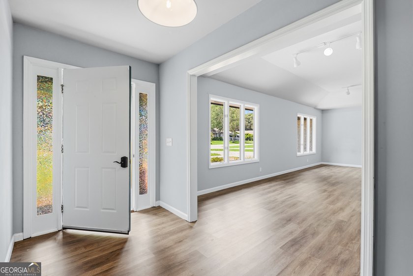 Plenty of space welcomes you in this 4/5 bedroom 2.5 bath home - photo 6