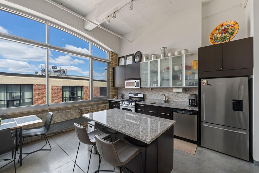 Live in the heart of the North Loop at Tower Lofts. This - photo 2