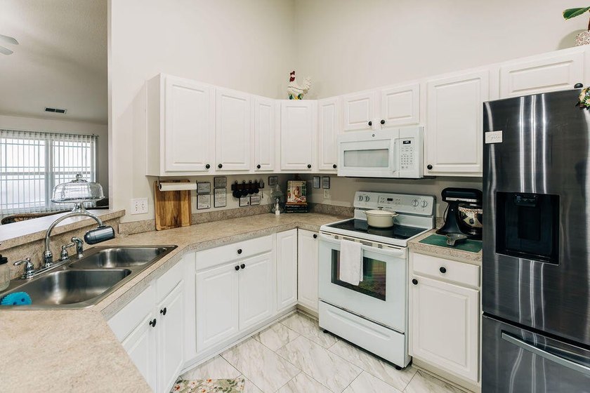 Welcome to this charming 3-bedroom, 2-bathroom home featuring a - photo 12