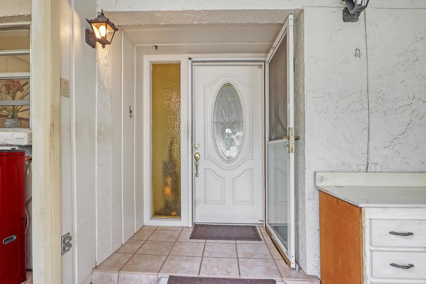 Step into this inviting two-bedroom, two-bathroom condo, where - photo 2