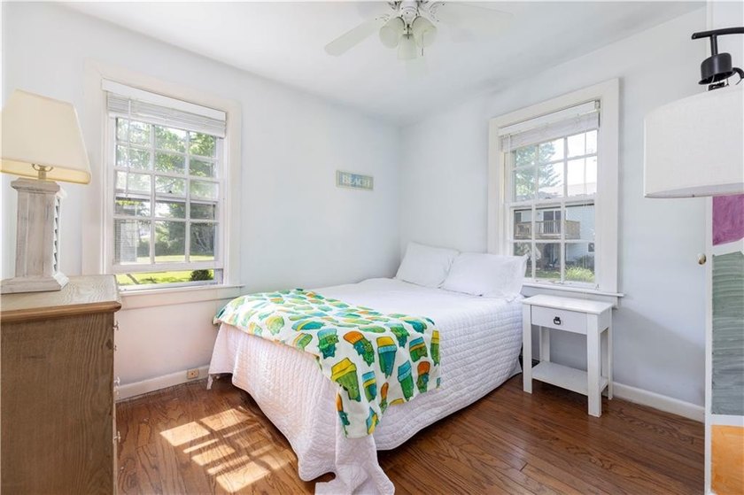 Nestled on desirable Harbour Island, this charming shingle-style - photo 22