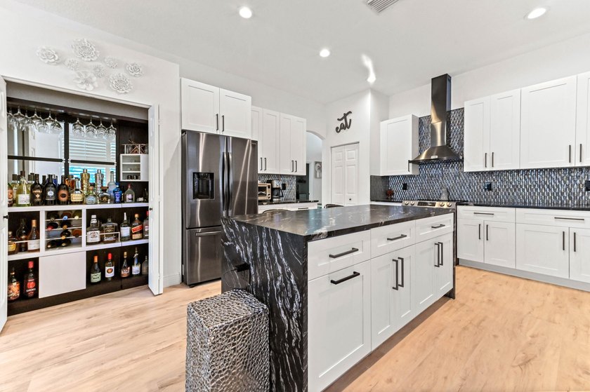 Welcome to this beautiful 1-story home in the gated community of - photo 3