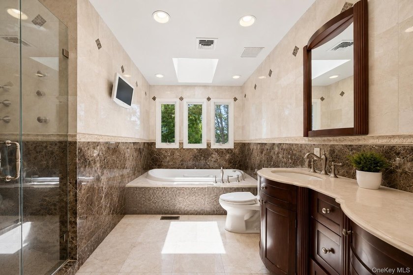 Welcome to this exceptional Hewlett residence, where timeless - photo 15