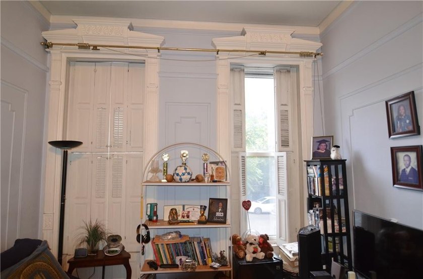 Welcome to this charming three-family brownstone, ideally - photo 14