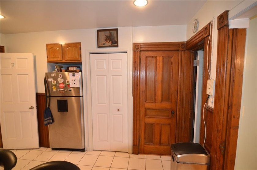 Welcome to this charming three-family brownstone, ideally - photo 17