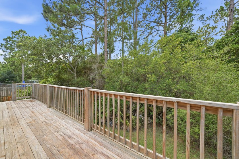 Set on a huge 0.52 acre lot with peaceful forest views, this - photo 44