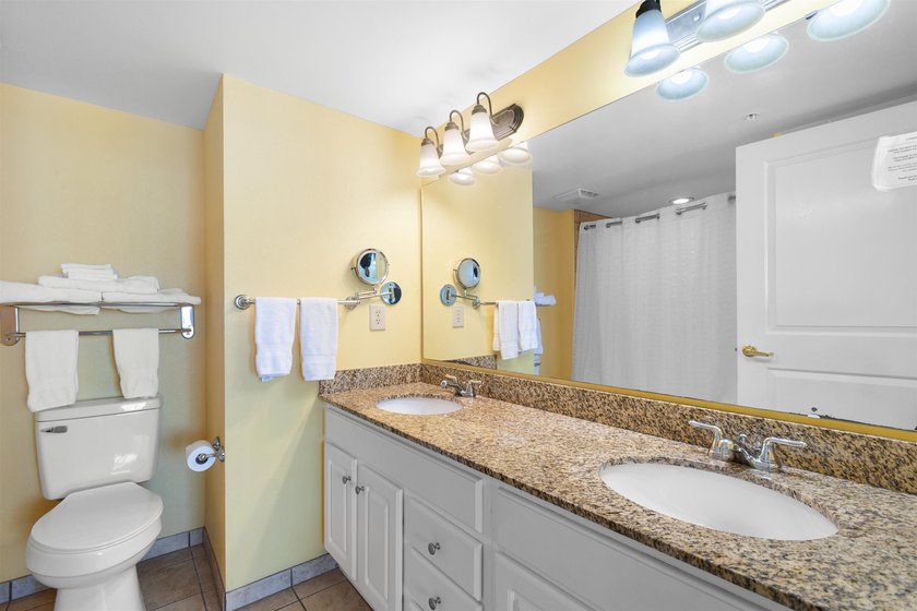 This beautifully furnished three bedroom Penthouse level unit at - photo 17