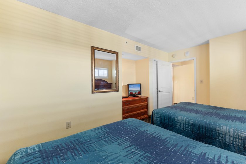 This beautifully furnished three bedroom Penthouse level unit at - photo 23