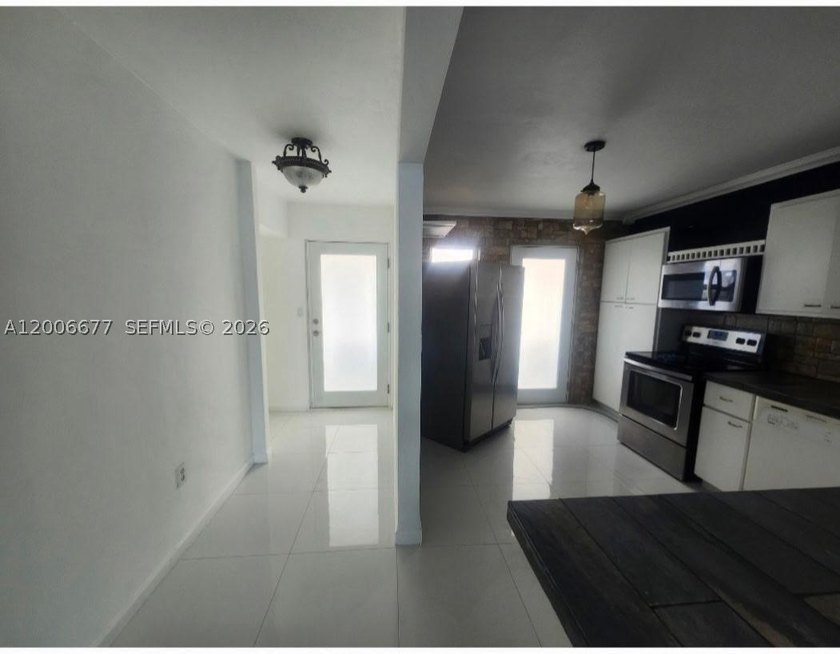 Enjoy direct waterfront living from this bright and spacious - photo 22