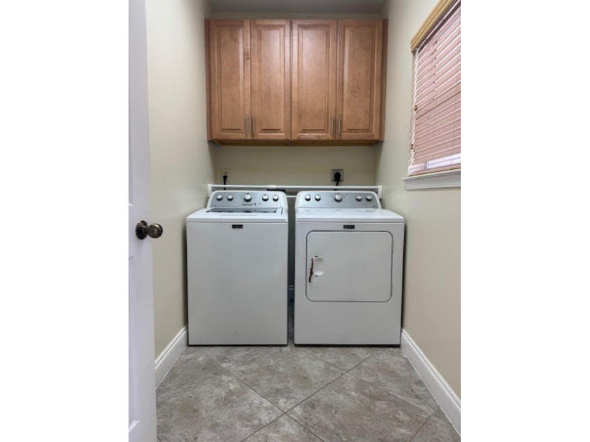 This fully furnished ground floor condo has tile floor and - photo 17